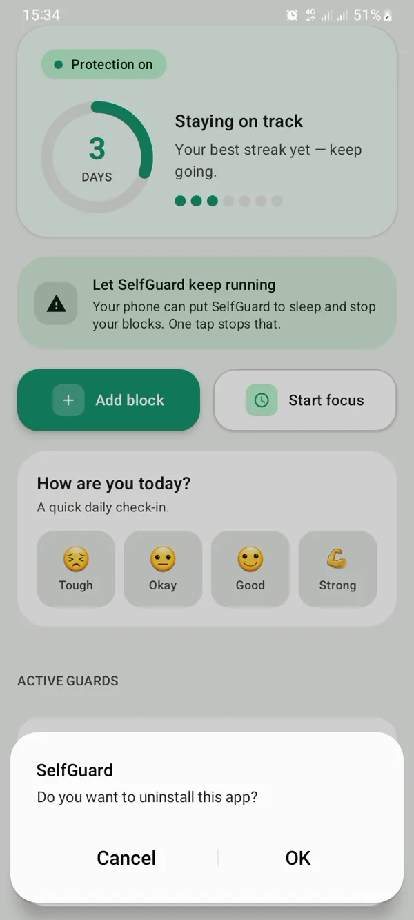 Android’s confirmation for deleting an app, over SelfGuard’s home screen.